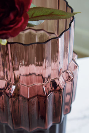  adds a captivating touch to indoor or outdoor decor. Its unique textured shape with oversized fluted detail creates an elegant art piece. Whether it-'s accentuating flowers or candlelight