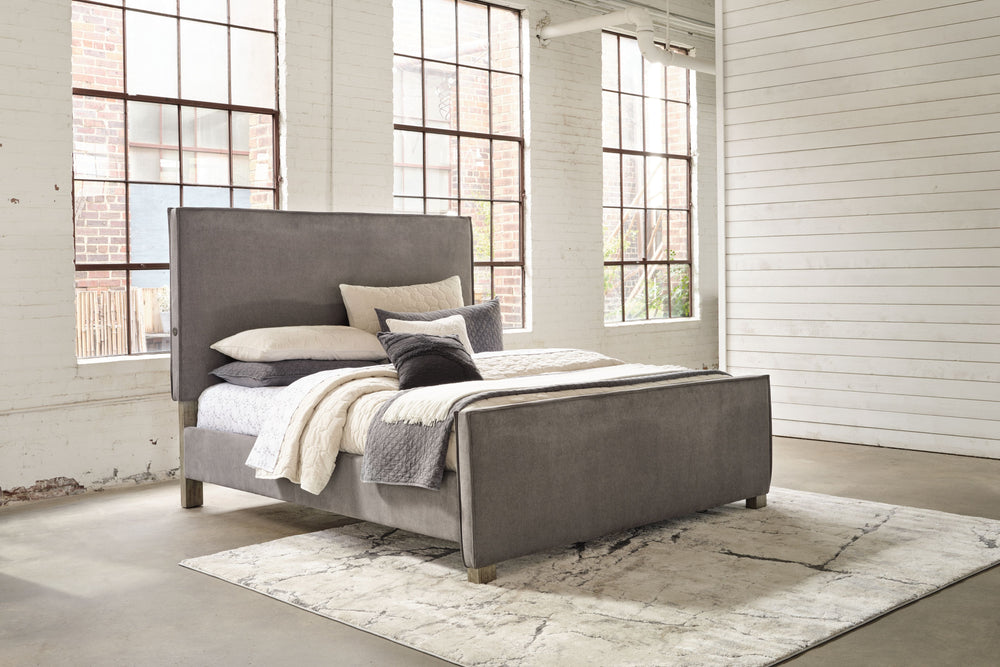 With a contemporary silhouette and downtown flair, this queen upholstered panel bed seamlessly fits in with existing modern decor. Its clean-lined profile and tailored slate gray upholstery give an urban sophistication. This chic bed also features a doubl