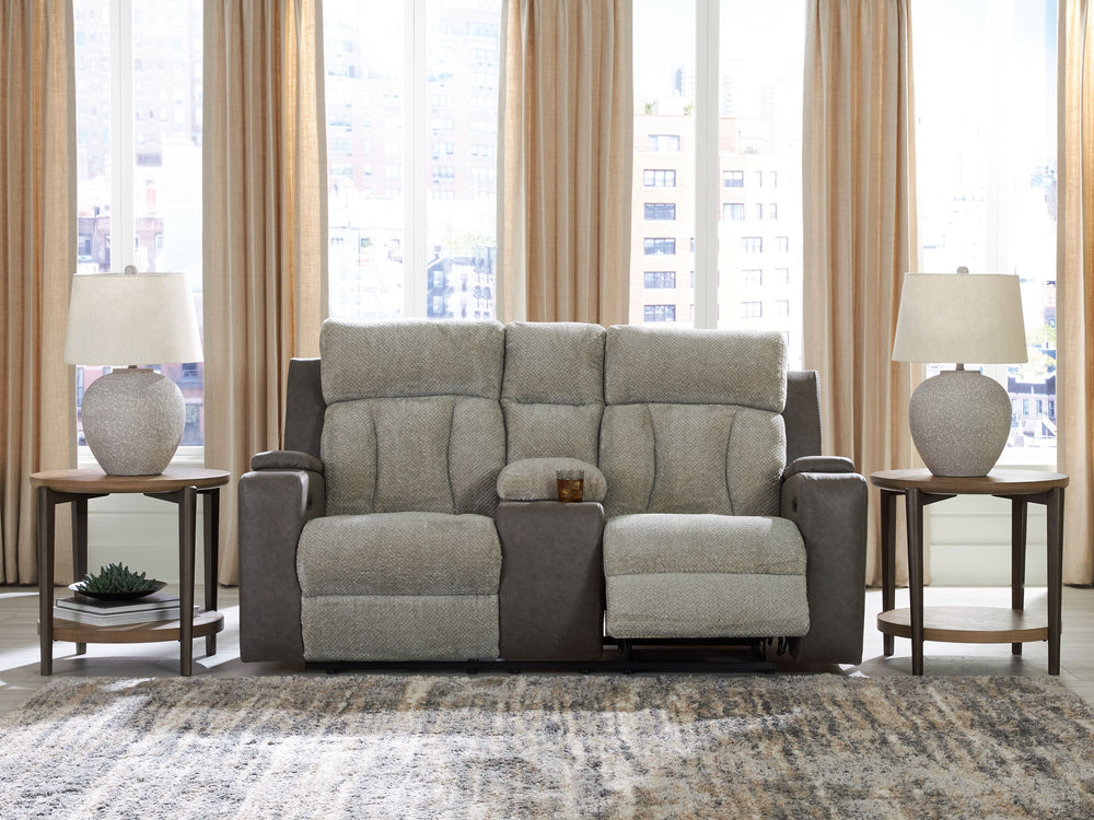 Refined relaxation, reimagined for the modern home. This power reclining loveseat combines premium comfort with smart features like built-in storage arms, USB charging and cup holders. One-touch reclining and adjustable headrests let you find your perfect