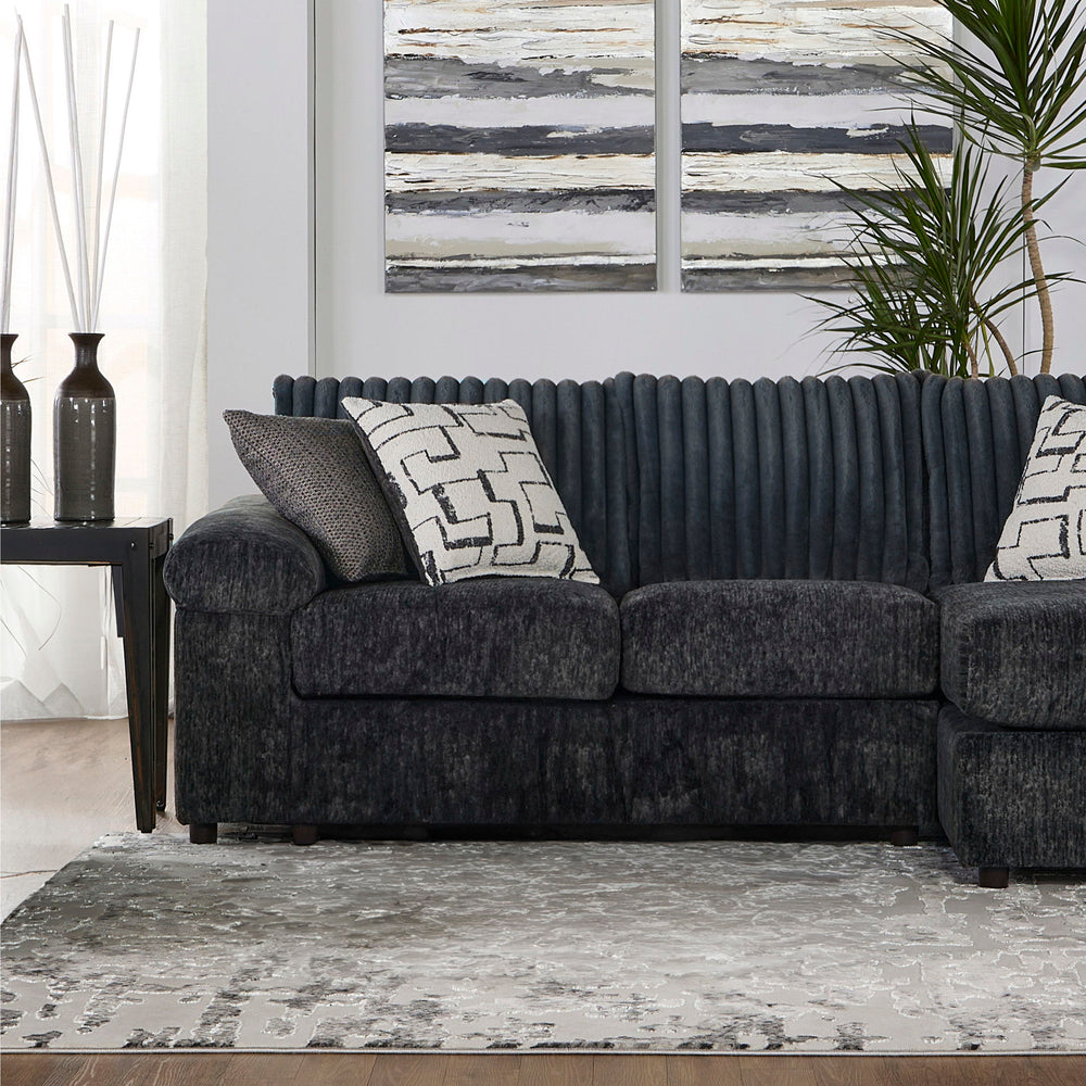 Introducing the Remi Right Arm Facing Chaise Lounge, a transitional marvel designed for those seeking comfort and style. This spacious lounger, boasting a roomy seat for three, is the perfect addition to your living space. Crafted in the USA, its solid an