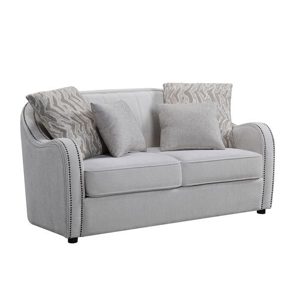 Create a clean, contemporary look with the gently curved Mahler living room set. The inner wooden frame and block plastic legs offer maximum support. Upholstered in a beige textured linen fabric and outlined with nailhead trim. The barrel seat and sloping