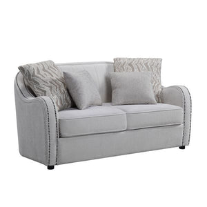  contemporary look with the gently curved Mahler living room set. The inner wooden frame and block plastic legs offer maximum support. Upholstered in a beige textured linen fabric and outlined with nailhead trim. The barrel seat and sloping