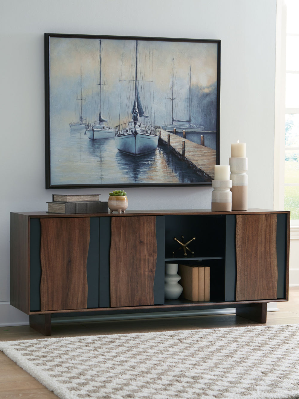 This accent cabinet recalls the rugged textures of nature and brings them indoors. Live edge door fronts pop against the neutral finish for a refined-meets-salvaged feel. Whether it-'s used as a chic storage piece or an eclectic TV stand, this cabinet rad