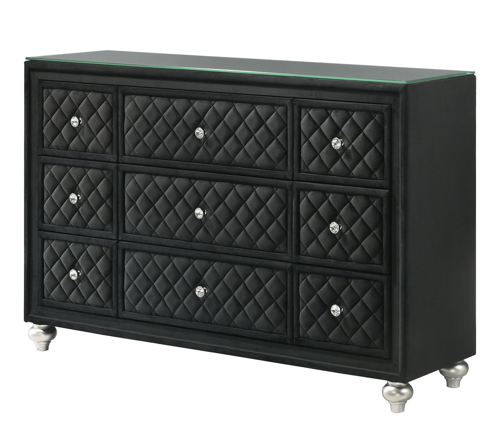 Indulge in timeless elegance and dramatic sophistication with this stunning bedroom collection, designed to make a bold statement. The centerpiece features an exquisitely tufted headboard with luxurious upholstery and intricate nailhead trim, exuding opul