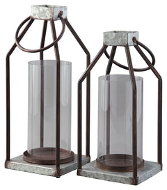 Whoever said you couldnâ€™t illuminate in style? This set of lanterns act as beautiful vessels for the romantic glow of pillar candles, whether placed in an indoor or outdoor space. The galvanized metal offers decor versatility, and the top metal handle a