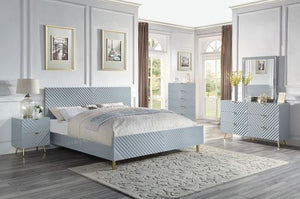 The Gaines Collection is a glamorous and sophisticated grouping that adds a chic style to any room. The gray gloss finish and gold metal accents help to accentuate the clean lines of the pieces and add a pop of glamour. The diagonal line design adds visua