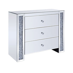 The Noralie Console Table will give any room a touch of glamour. This contemporary console table is fully mirrored with a stunning mirror top and a faux gem inlay on each leg of its sled base. Use this unique piece as the perfect accent for any room Decor