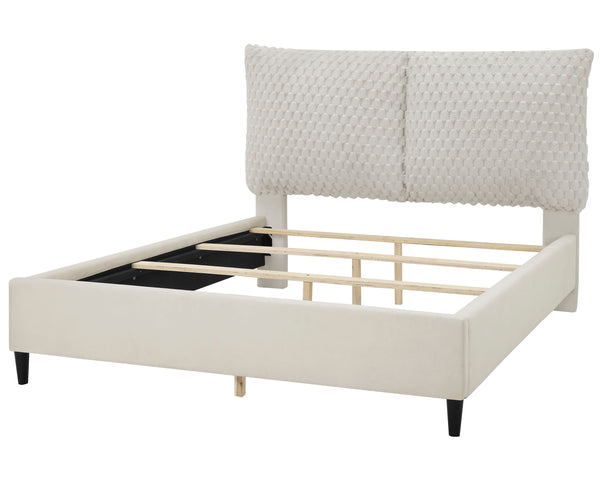  tufted headboard that rises high to make a grand statement