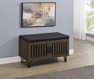  featuring a faux leather upholstered padded top for added versatility as a seating bench. The cabinetâ€™s two doors showcase a vertical slat design