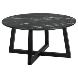 The coffee table stands as a centerpiece, its round form a canvas for the rich, decorative black faux marble that offers the beauty of natural stone with none of its fragility. The high-pressure laminate surface is a triumph of design, melding high durabi