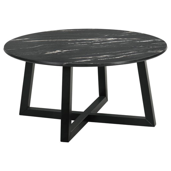The coffee table stands as a centerpiece, its round form a canvas for the rich, decorative black faux marble that offers the beauty of natural stone with none of its fragility. The high-pressure laminate surface is a triumph of design, melding high durabi