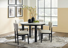 Clean lines meet cool curves with this dining set. Chunky round post legs and a black finish lend a modern vibe, while chairs with softly textured upholstery tempt you to sit and stay awhile. What a delicious choice for a dining room update. <h4><b>Xandru