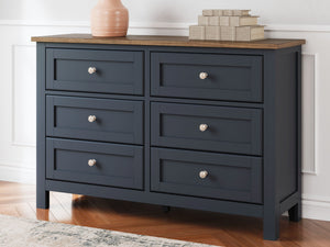  this dresser pairs a dark slate blue finish with a light brown top. Drawer fronts and legs in a classic Shaker style bring an air of beautiful simplicity to the bedroom. W