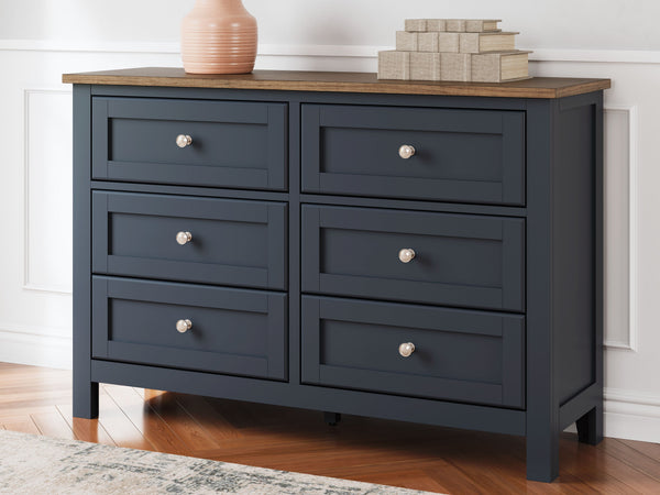  this dresser pairs a dark slate blue finish with a light brown top. Drawer fronts and legs in a classic Shaker style bring an air of beautiful simplicity to the bedroom. W