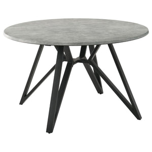 Elevate your modern industrial dining area with this retro-inspired round dining table. Designed with a high pressure laminate table top with a concrete-looking decoration paper, this dining table offers a raw, organic texture to the space. The spacious, 