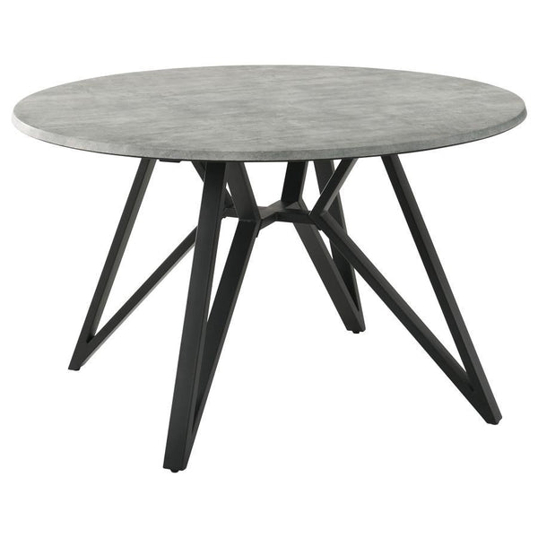 Elevate your modern industrial dining area with this retro-inspired round dining table. Designed with a high pressure laminate table top with a concrete-looking decoration paper, this dining table offers a raw, organic texture to the space. The spacious, 