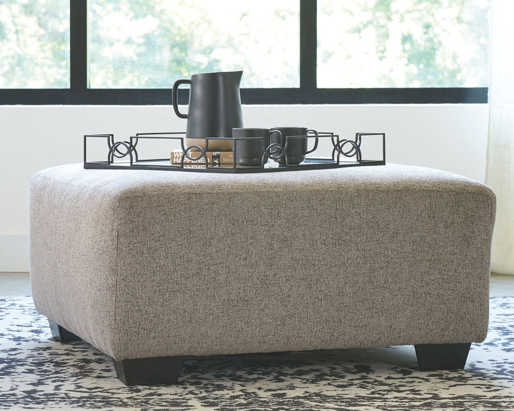 A mastery in less is more, this living room set manages to make cool, contemporary design so warm and cozy. A new twist on neutral, the sectionalâ€™s soothing â€œplatinumâ€ tone upholstery is incredibly plush to the touch. Gently rounded corners give the