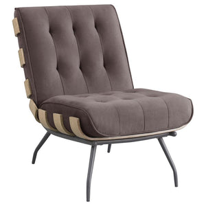The definition of casual lies in a chic style with a coastal vibe, perfect for accenting your sun porch, living room, or family room. This accent chair features a reworked outdoor lounge chair motif with a seamed and tufted back cushion and an oversized s