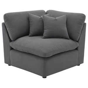 Complete your modular sectional with this versatile corner chair, designed to create a seamless transition between seating pieces. Upholstered in a sophisticated charcoal grey performance fabric, this chair offers plush comfort and a modern aesthetic that
