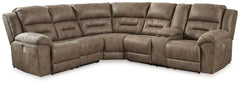 This power reclining sectional is designed exclusively for those who are serious about R&R. Its overstuffed cushions and pillow top arms feel oh-so-plush, and the faux leather upholstery accented with jumbo stitching is silky soft. Go from upright to recl