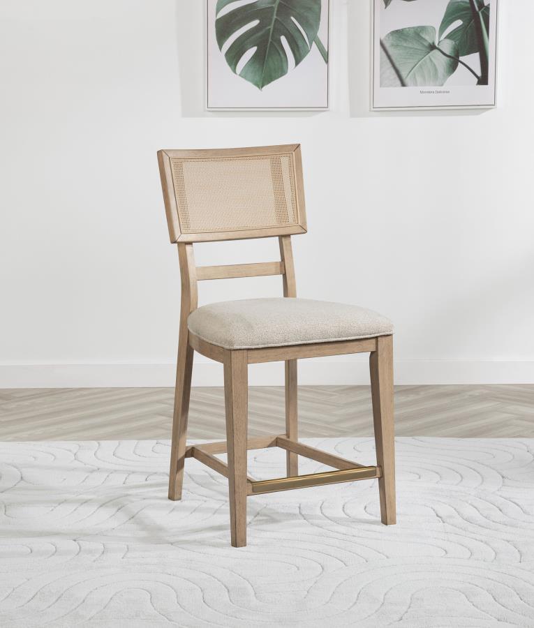 Elevate your dining experience with this stylish counter-height chair, combining natural beauty and modern comfort. Crafted from solid wood, this chair features a hand-woven radio weave cane backrest that adds a light and airy feel to your space. The foam