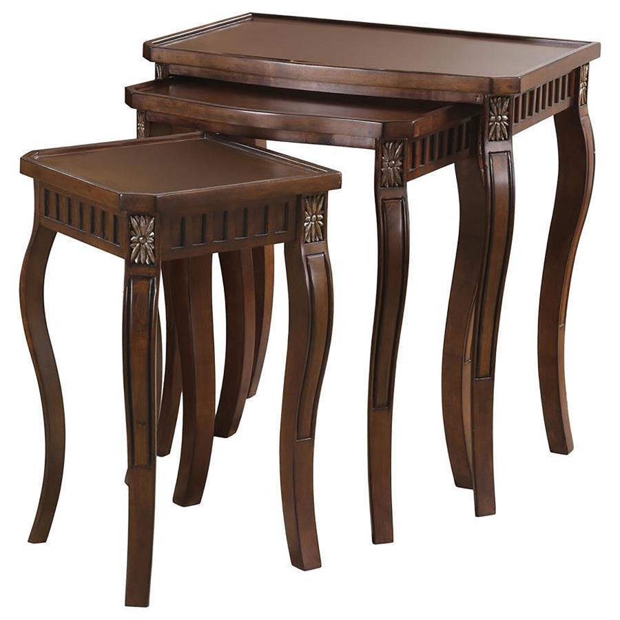 This three-piece nesting table set showcases an elegant design with beautiful detailing on the legs. The warm brown finish adds to its rich, traditional style, making it perfect for any living room space. The tables are crafted from durable engineered woo