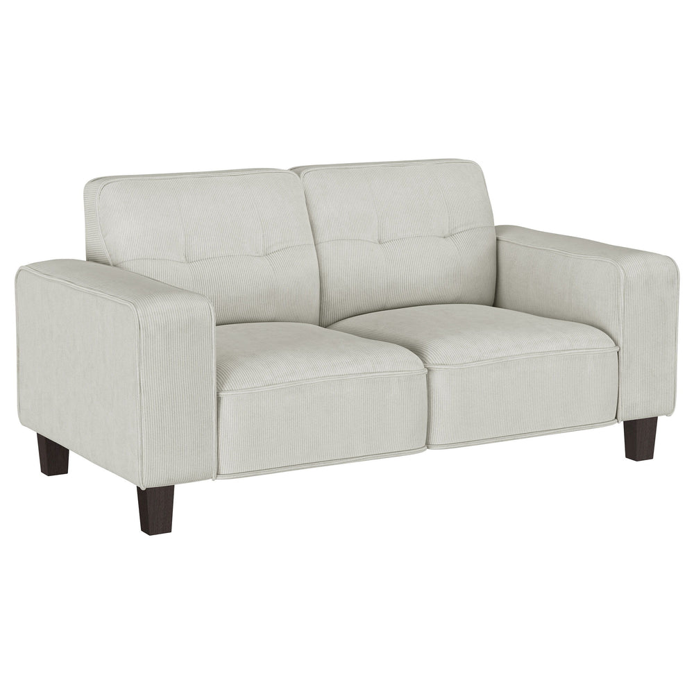 Inject impressive comfort and impeccable style with a modern loveseat in your living room or den. Its tufted back cushions add depth and dimension, perfect for a touch of character in your living area. Plush, soft upholstery in a neutral hue complements p