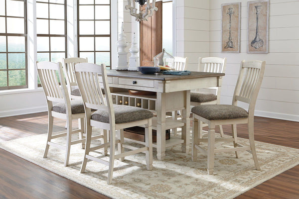 Unique two-tone finish with a combination of Oak and Acacia substrates combining a trendy textured antique white color with table and server tops finished in a textural weathered oak finish. Rectangular dining table features six convenient drawers for sto