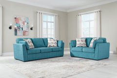 You want your home to reflect your modern, trendy eye for design. This seating package is here to help. Bold, bright and beautiful, it adds a fashion-forward pop of color to your living room. Velvet-like upholstery and matching bolster pillows keep comfor