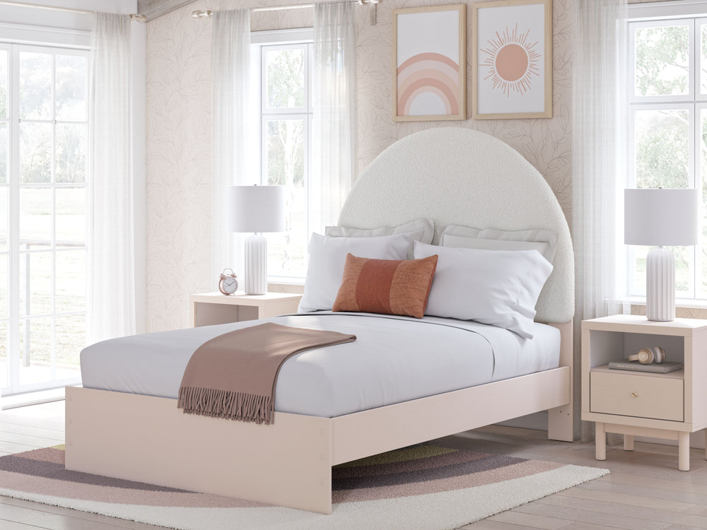 Pretty in pink. This full upholstered panel bed keeps the spirit of your homeâ€™s modern aesthetic while suiting all your young oneâ€™s needs. Its cozy-cute upholstery and subtle blush finish bring a playful, charming vibe to bedtime. Made for her and sty