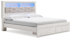 The epitome of fashion-forward design, this king upholstered bookcase bed is a beautiful blend of comfort and luxury. Shiny chrome-tone accents, a pearlized finish and button-tufted upholstery bring a glam touch to the richly rustic appearance. Remote-con