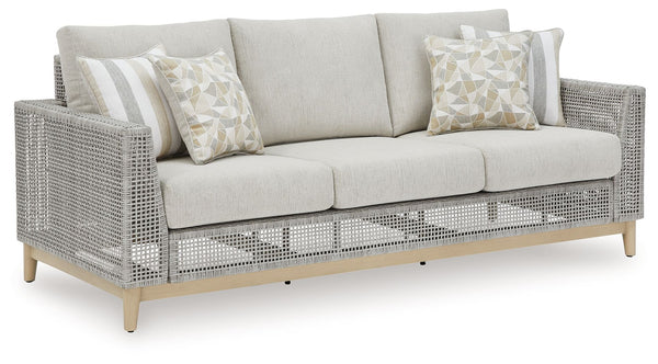 This sofa invites your casual contemporary style outdoors. With its resin wicker in a chic neutral hue