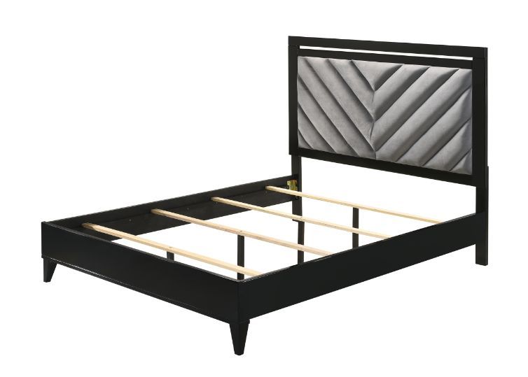 Sleep in style with this modern Chelsie bedroom collection. The sturdy bed is a focal point on its own with its gray channel-tufted headboard and tapered legs. Add depth and reflect light with its silver trim that is featured throughout the bed and case g