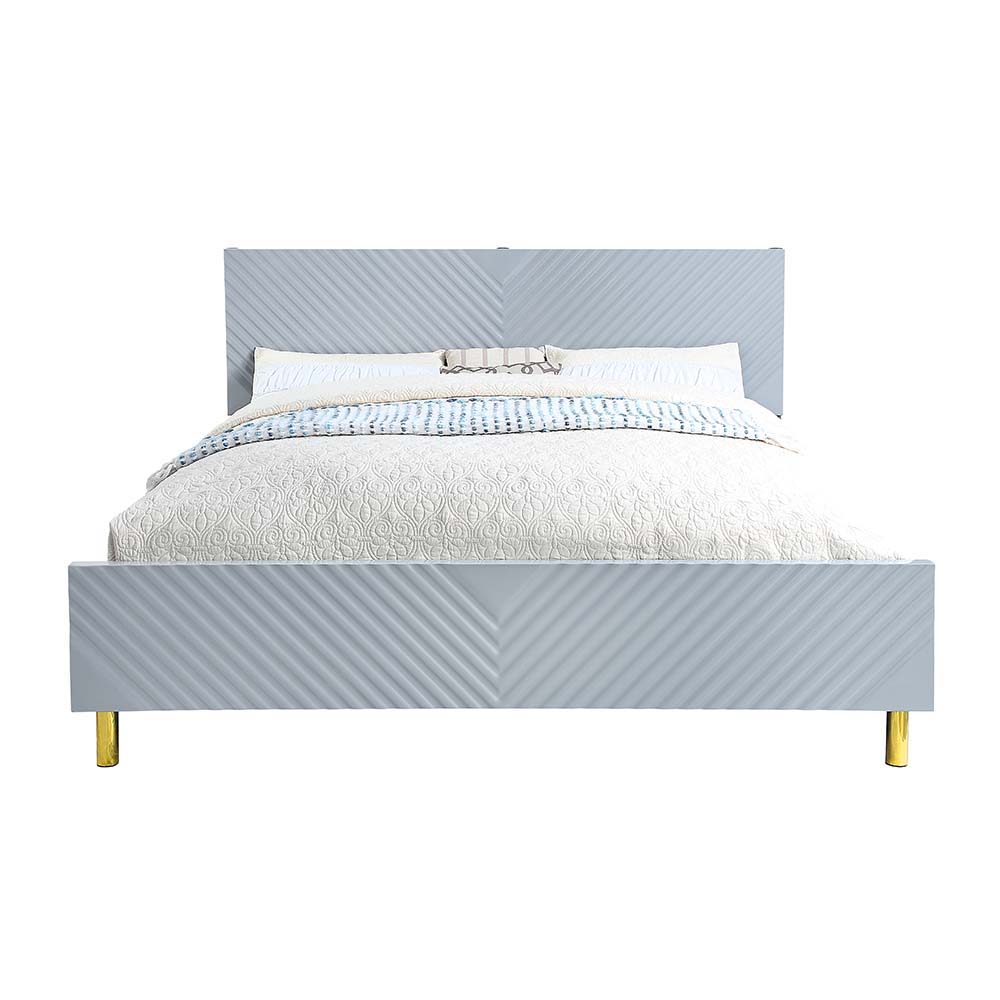 The Gaines Collection is a glamorous and sophisticated grouping that adds a chic style to any room. The gray gloss finish and gold metal accents help to accentuate the clean lines of the pieces and add a pop of glamour. The diagonal line design adds visua