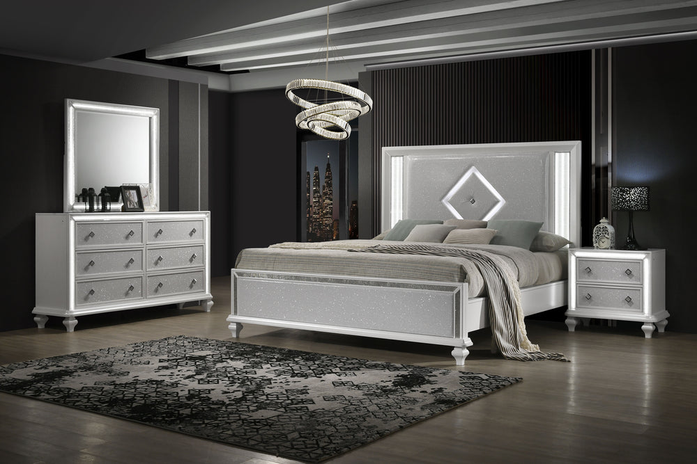 Transform your bedroom into a sanctuary of elegance with the Stardust 4 Piece Bedroom Suite in gleaming white. The set includes a Bed, Dresser, Mirror and Nightstand. Crafted to stand the test of time, each piece is meticulously constructed from manufactu