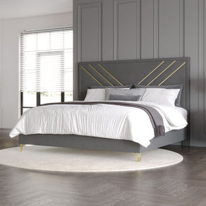 Experience luxury with the Symmetry Upholstered Panel Bed in Gray. Crafted from premium woods with a gray marble laminate, it radiates timeless elegance. Gold metal and mylar accents shine against ultra-soft gray fabric, while intricate detailing adds sop