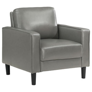 From your stylish home to a professional setting, this modern armchair is a chic choice. It features a structured silhouette with a compact footprint and straight track arms. Faux leather upholstery is smooth and sleek, offering a refined touch that can b