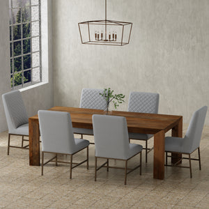 Crafted from solid mango, this table boasts a unique aesthetic with natural variations of color, wood grain, and knots. The geometric mitered edge creates a seamless transition between the table top, apron, and angled legs, and is generously proportioned 