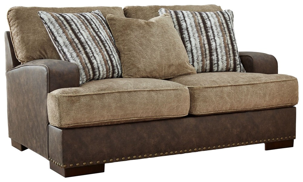 Punctuated by a subtle band of nailhead trim, this loveseat is perfect for those who love the look of leather. Two textural tones provide twice the style and comfortâ€”and incorporate an added layer of visual interest. Throw pillows add a fun decorative e