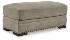 Looking to enhance your home-'s visual appeal? This ottoman offers sophisticated design, comfort and elegance with tonal colors and nailhead accents. Enjoy optimal coziness with luxurious soft upholstery and a feather-blend cushion. Perfect for modern spa