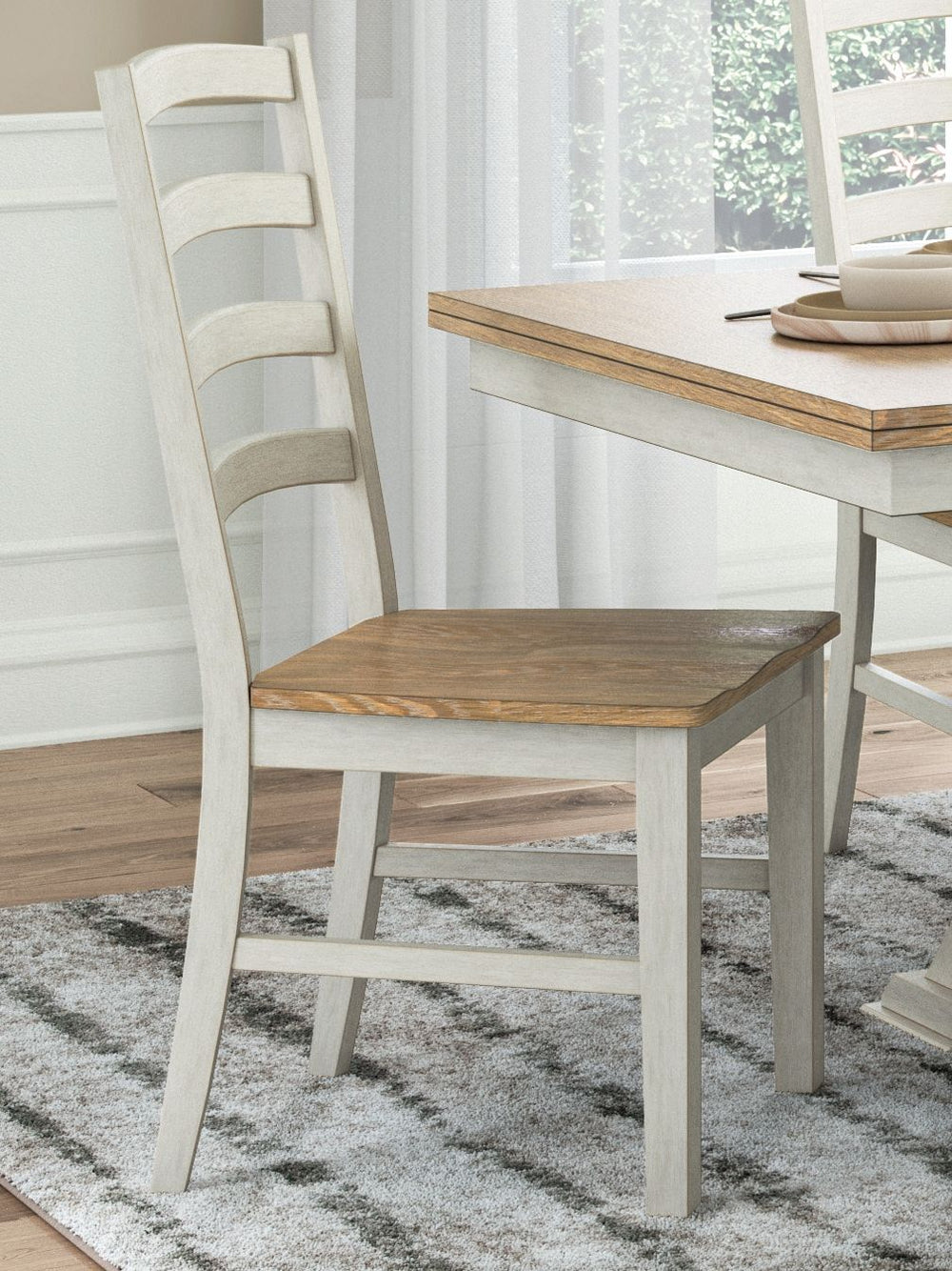 Busy breakfasts and family dinners get a dose of modern farmhouse flair with this dining chair. Its two-tone finish contrasts a light butcher block hue with an antiqued white frame for an utterly charming effect. A contoured seat elevates the comfort leve