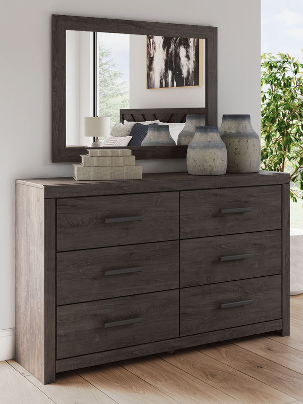  this dresser with mirror is a simply chic approach to modern living. A dark charcoal finish blends black and brown undertones