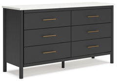 This dresser reflects your sophisticated approach to boho style. Crafted with both form and function in mind, its replicated marble top beautifully contrasts a matte black finish. The versatile design suits all-neutral spaces or blends with your favorite 