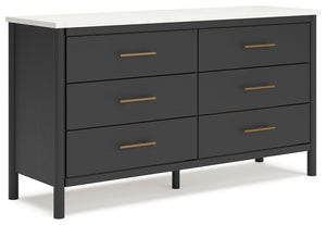 This dresser reflects your sophisticated approach to boho style. Crafted with both form and function in mind, its replicated marble top beautifully contrasts a matte black finish. The versatile design suits all-neutral spaces or blends with your favorite 