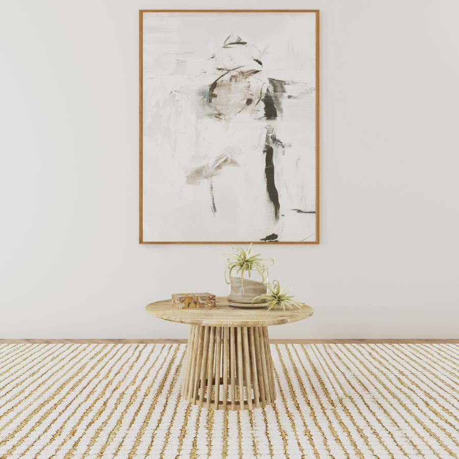 Handcrafted from solid mango wood, this 30-inch round coffee table infuses your living room with natural warmth and organic charm. As a center table or cocktail table, it brings timeless appeal and functionality. Its sturdy design and subtle grain pattern