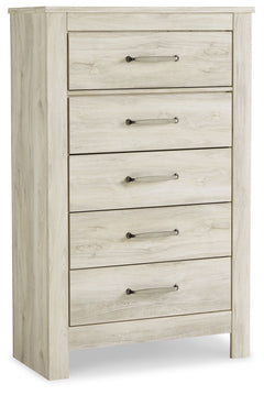 Your bedroom isnâ€™t just a room. Itâ€™s a canvas. Express your farmhouse style with this chest of drawers. Wispy white finish over replicated oak wood grain brightens up the space with charm. Brushed nickel-tone handles with black edging finesse the piec