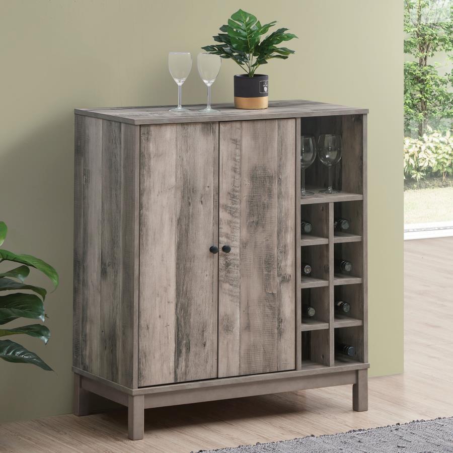 Perfect for compact homes comes this rustic wine cabinet. With a weathered Acacia wood-like finish over the frame, this wine cabinet lends itself to modern farmhouse style living rooms and dining rooms. On the right side are eight wine bottle storage cubb