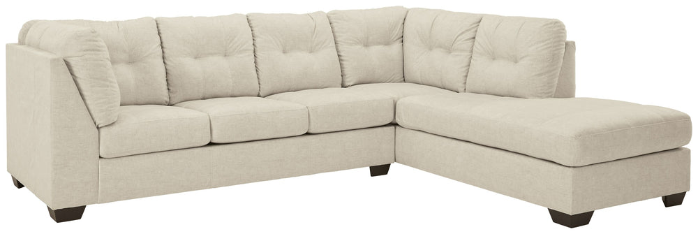 Destination: urban oasis. Elevate your design aesthetic with a chic look inspired by city living. Sleek, sultry and tailored to a T, this sectional lures with comfortable box cushions and dramatic jumbo stitching for fashion-forward flair. Wrapped in a pa