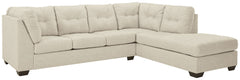 Destination: urban oasis. Elevate your design aesthetic with a chic look inspired by city living. Sleek, sultry and tailored to a T, this sectional lures with comfortable box cushions and dramatic jumbo stitching for fashion-forward flair. Wrapped in a pa