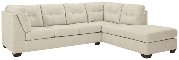 Destination: urban oasis. Elevate your design aesthetic with a chic look inspired by city living. Sleek, sultry and tailored to a T, this sectional lures with comfortable box cushions and dramatic jumbo stitching for fashion-forward flair. Wrapped in a pa